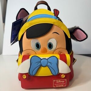 NWT. Loungefly Disney 100 Anniversary Pinocchio Donkey w/ tail Mini Backpack.
